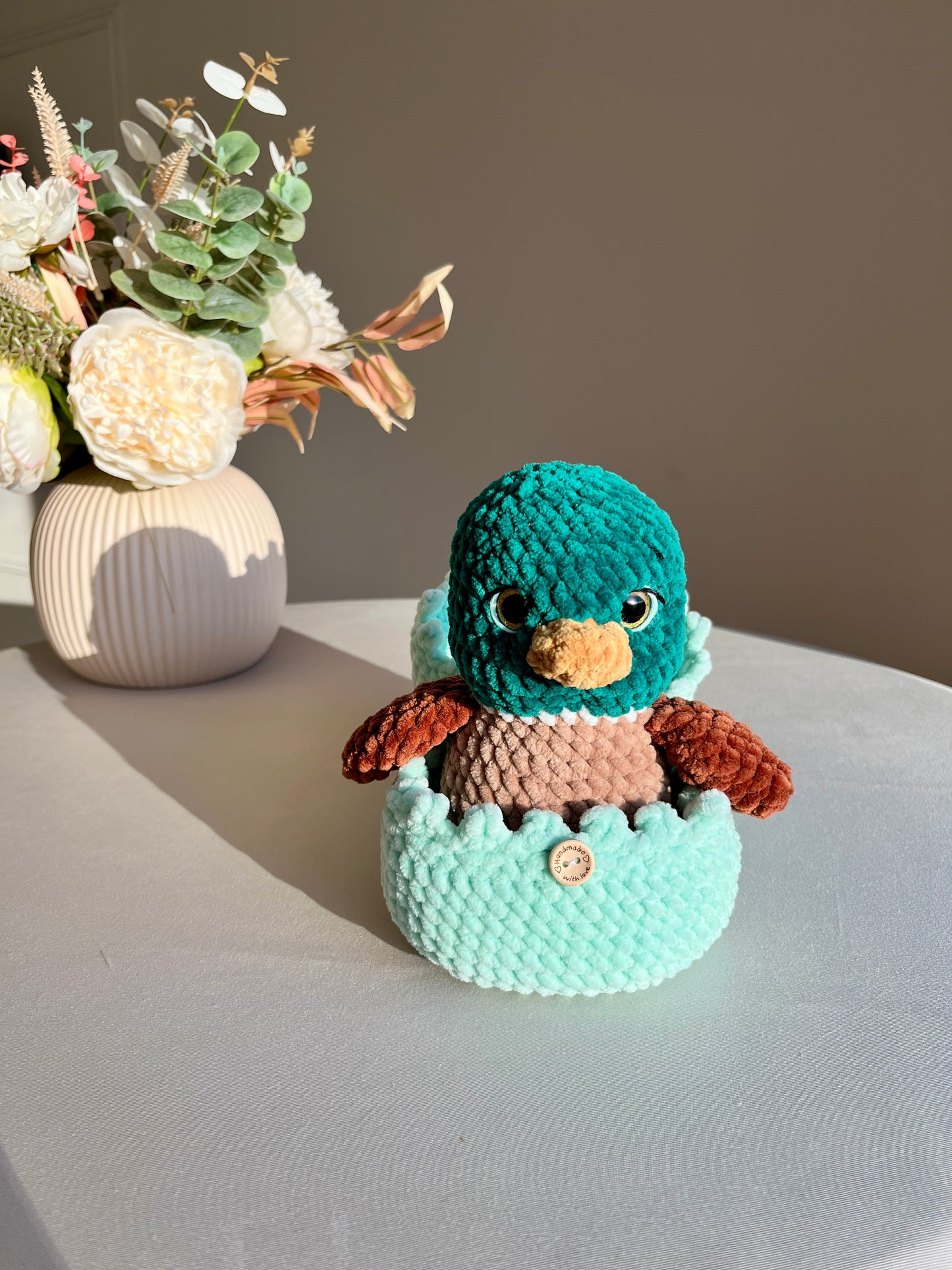 Crochet Duck and its Cozy Shell
